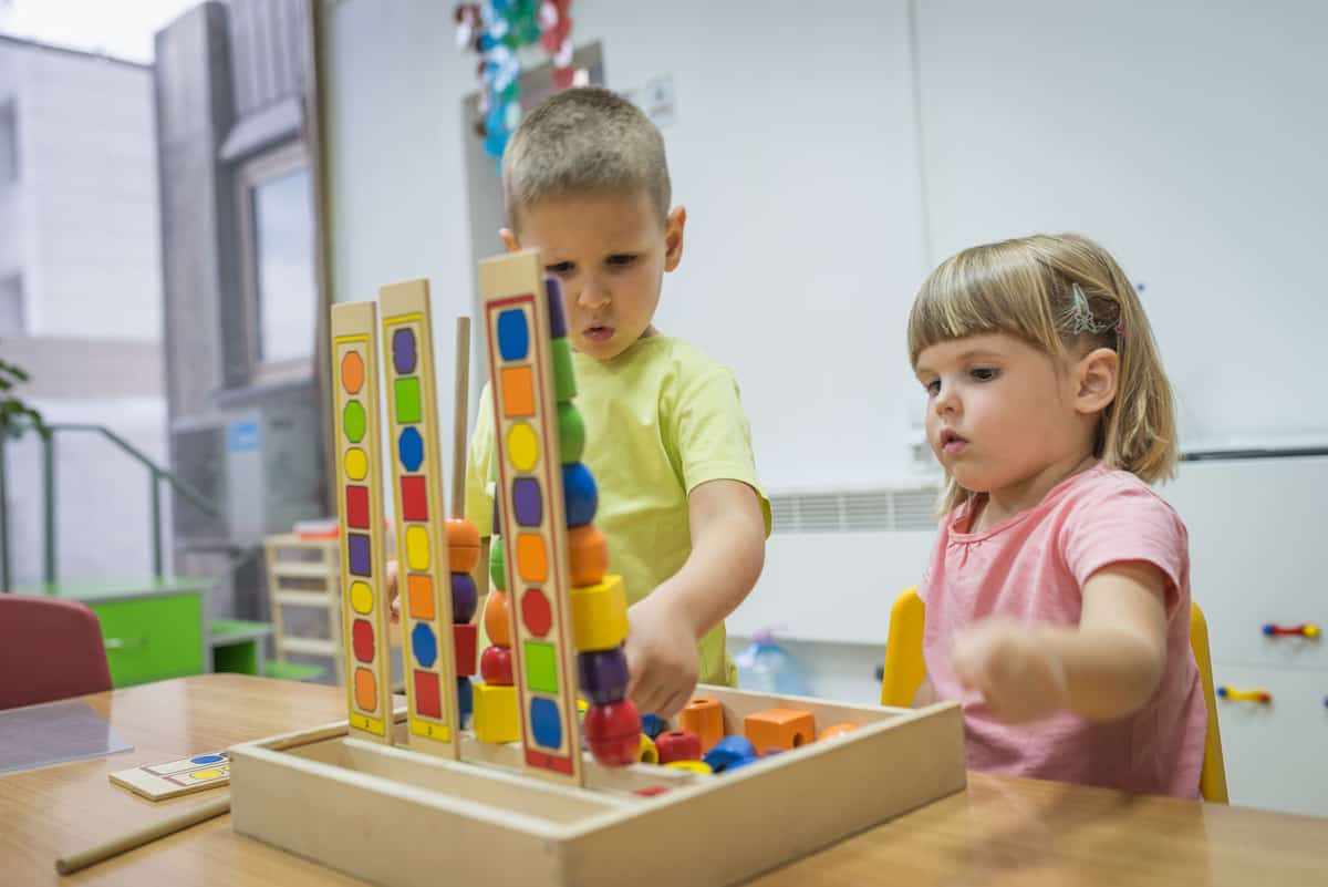 Caucasian children are playing in kindergarten